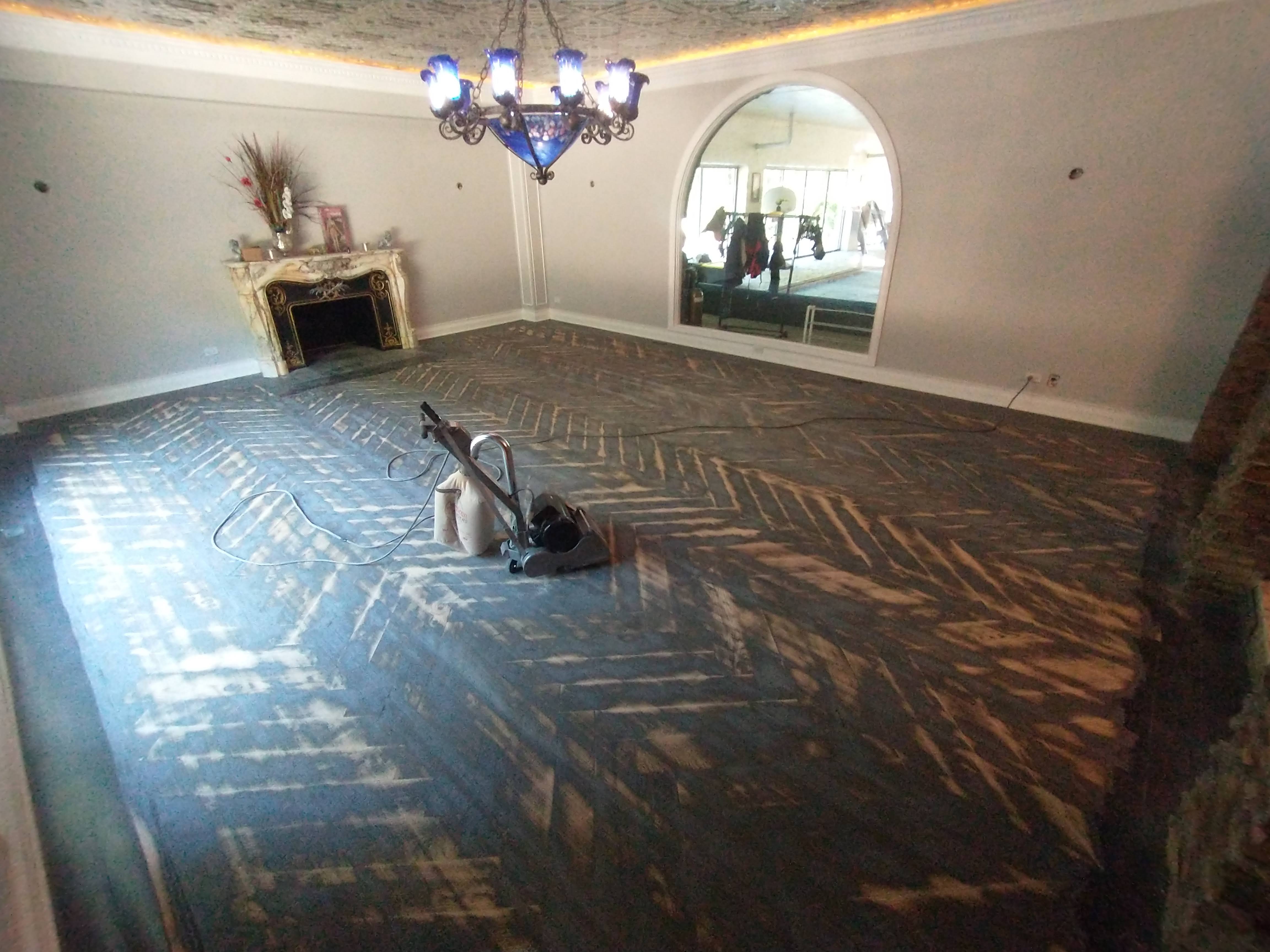 Living room floor refinishing in progress